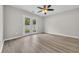 This bedroom has light grey walls and light wood floors with sliding glass doors at 1077 Stoney Falls Blvd., Myrtle Beach, SC 29579