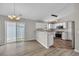 Stylish kitchen and dining area featuring white cabinets, modern appliances, and beautiful flooring at 1077 Stoney Falls Blvd., Myrtle Beach, SC 29579