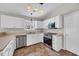 Well-lit kitchen featuring stainless steel appliances and white cabinets at 1077 Stoney Falls Blvd., Myrtle Beach, SC 29579