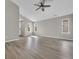 Spacious living room with a vaulted ceiling, neutral paint, new floors, and large windows at 1077 Stoney Falls Blvd., Myrtle Beach, SC 29579