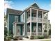 Charming two-story home showcasing double porches, beautiful blue siding, and a well-maintained, landscaped front yard at 1083 Milford Way, Myrtle Beach, SC 29588