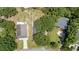 Bird's eye view of house surrounded by greenery, showcasing rooftop details and neighboring homes at 109 Wofford Rd., Conway, SC 29526