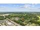 Overhead shot of home nestled among lush greenery, with nearby commercial areas and roadways; marked by a 'Home' indicator at 109 Wofford Rd., Conway, SC 29526