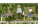 Aerial view of houses with swimming pools nestled amongst trees; street visible in the foreground at 109 Wofford Rd., Conway, SC 29526