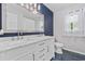 Bathroom featuring a double vanity, marble countertop, and blue tiled floor at 109 Wofford Rd., Conway, SC 29526