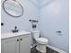 Bathroom view featuring tile flooring, a modern vanity, and a round mirror at 109 Wofford Rd., Conway, SC 29526