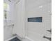 Bathroom with subway tile, bathtub, and a niche featuring a blue mosaic tile accent at 109 Wofford Rd., Conway, SC 29526