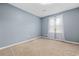 Neutral bedroom with plush carpeting and a window providing natural light at 109 Wofford Rd., Conway, SC 29526