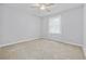 Neutral bedroom with plush carpeting and a window providing soft natural light at 109 Wofford Rd., Conway, SC 29526