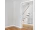 Hallway view of staircase with wood floors and white risers at 109 Wofford Rd., Conway, SC 29526