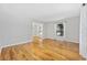 Bright living room featuring polished hardwood floors and natural light from two large windows at 109 Wofford Rd., Conway, SC 29526