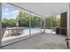 Screened patio overlooking a sparkling blue pool, perfect for outdoor dining and relaxation at 109 Wofford Rd., Conway, SC 29526