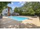 Backyard pool area with a diving board, lounge chairs, and mature trees at 109 Wofford Rd., Conway, SC 29526