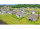 Aerial perspective of a neighborhood displaying homes with fenced backyards, patios, and well-maintained lawns and landscaping at 1108 Donald St., Conway, SC 29527