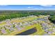 Vast aerial view of a community surrounded by lush greenery and featuring ponds, showcasing the serene neighborhood layout at 1108 Donald St., Conway, SC 29527