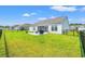 Spacious, fenced backyard with well-maintained lawn, grill, and screened-in porch at 1108 Donald St., Conway, SC 29527