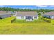 Spacious backyard features a black fence, screened porch, and a patio with outdoor seating for relaxation and entertaining at 1108 Donald St., Conway, SC 29527