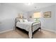 Cozy guest bedroom features a decorative metal frame bed, neutral decor, and ample natural light from the window at 1108 Donald St., Conway, SC 29527