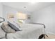 Well-lit bedroom features a comfortable bed, soft window lighting, and decorative artwork at 1108 Donald St., Conway, SC 29527