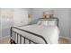 Comfortable bedroom with a black metal bed frame and coastal-themed decor at 1108 Donald St., Conway, SC 29527