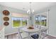 Charming dining area boasts a modern chandelier and sliding glass doors to the patio at 1108 Donald St., Conway, SC 29527