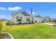 Picturesque home with lush lawn, detailed landscaping, and a view of the attached garage at 1108 Donald St., Conway, SC 29527