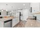 Spacious kitchen with granite countertops, stainless appliances, and adjoining living area at 1108 Donald St., Conway, SC 29527