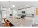 Well-lit kitchen offers a functional island with bar stools and plenty of cabinet space at 1108 Donald St., Conway, SC 29527
