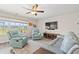 Comfortable living room with large windows, stylish ceiling fan, and contemporary furniture at 1108 Donald St., Conway, SC 29527