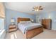 The spacious main bedroom features a wood bed frame, neutral carpeting, and soft blue walls at 1108 Donald St., Conway, SC 29527
