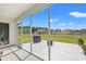 Relax in this screened in porch overlooking the backyard with grill, patio furniture, and meticulously kept lawn at 1108 Donald St., Conway, SC 29527