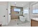 Primary bathroom showcasing modern tub and shower with glass surround and beautiful finishes at 1112 Whispering Winds Dr., Myrtle Beach, SC 29579