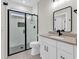 Modern bathroom featuring a glass-enclosed shower with stylish tilework, sleek fixtures, and a contemporary vanity at 1112 Whispering Winds Dr., Myrtle Beach, SC 29579