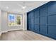 Stylish bedroom features hardwood floors, recessed lighting, a ceiling fan, and a large window with neighborhood views at 1112 Whispering Winds Dr., Myrtle Beach, SC 29579