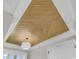 Unique ceiling detail with wood planking and a modern light fixture adding architectural charm to the room at 1112 Whispering Winds Dr., Myrtle Beach, SC 29579