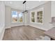 Bright dining area with large windows offering natural light and neighborhood views at 1112 Whispering Winds Dr., Myrtle Beach, SC 29579