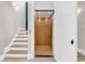 Interior view of an elevator with wood paneled walls, offering convenience and accessibility within the home at 1112 Whispering Winds Dr., Myrtle Beach, SC 29579