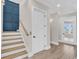 Bright hallway with stairs and a door to an elevator providing convenient access to multiple floors at 1112 Whispering Winds Dr., Myrtle Beach, SC 29579