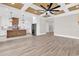 Open-concept kitchen and living space, featuring coffered ceilings, stainless appliances, and island at 1112 Whispering Winds Dr., Myrtle Beach, SC 29579