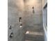 Modern bathroom featuring a tiled shower with a built-in bench and niche at 1115 Rosefield Way, Calabash, NC 28467