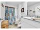 Well-lit bathroom featuring a shower, toilet, vanity, and decorative touches at 113 Arbor Crest Ln., Tabor City, NC 28463