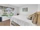 Bright bedroom featuring a window with blinds, soft bed, and dresser at 113 Arbor Crest Ln., Tabor City, NC 28463