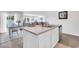 Kitchen island with stainless steel dishwasher, sink, and an adjacent dining area at 113 Arbor Crest Ln., Tabor City, NC 28463