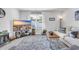 Cozy living room with a large TV and a comfortable white couch, perfect for relaxing and entertaining guests at 113 Arbor Crest Ln., Tabor City, NC 28463