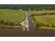 Overhead shot displays a boat ramp and dock area that is set off the main road, surrounded by tall trees at 116 Capt Anthony White Ln., Georgetown, SC 29440