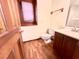 Simple bathroom features a single sink vanity, toilet and shower with natural light from the window at 116 Capt Anthony White Ln., Georgetown, SC 29440