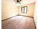 Spacious bedroom with neutral carpet, ceiling fan, and a large window providing ample natural light at 116 Capt Anthony White Ln., Georgetown, SC 29440