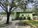 Charming single-story home boasts a light-green exterior with brick accents and a well-maintained front yard at 116 Capt Anthony White Ln., Georgetown, SC 29440
