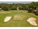Overhead image features a well-manicured golf course with sand traps and a green with surrounding properties at 116 Capt Anthony White Ln., Georgetown, SC 29440