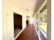 Bright hallway features an abundance of windows providing exterior light with a partial view of the property grounds at 116 Capt Anthony White Ln., Georgetown, SC 29440
